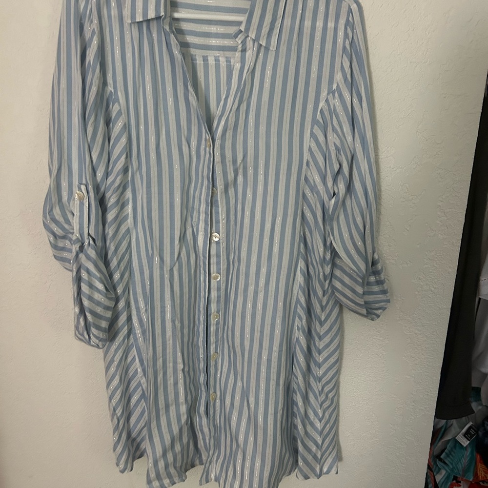 Long sleeve light blue, white and metallic button down blouse with button cuffs